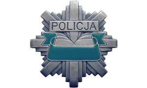 Zdjęcie przedstawia policyjną odznakę.